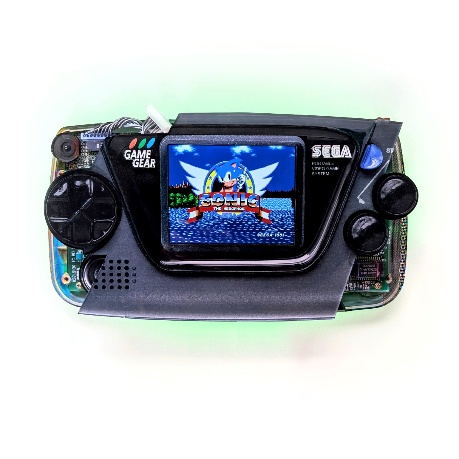 Connor Gottfried - *Batteries Not Included, 2025, Laser cut acrylic, 6 color print, 8” IPS screen, Raspberry Pi, Game Gear...