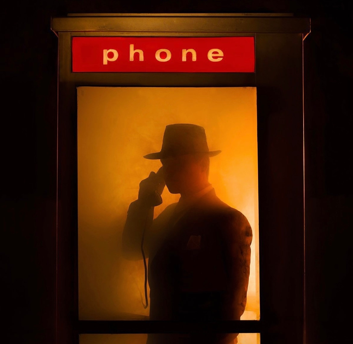 Tyler Shields - The Man in the Phone Booth II, 2022, Digital c print