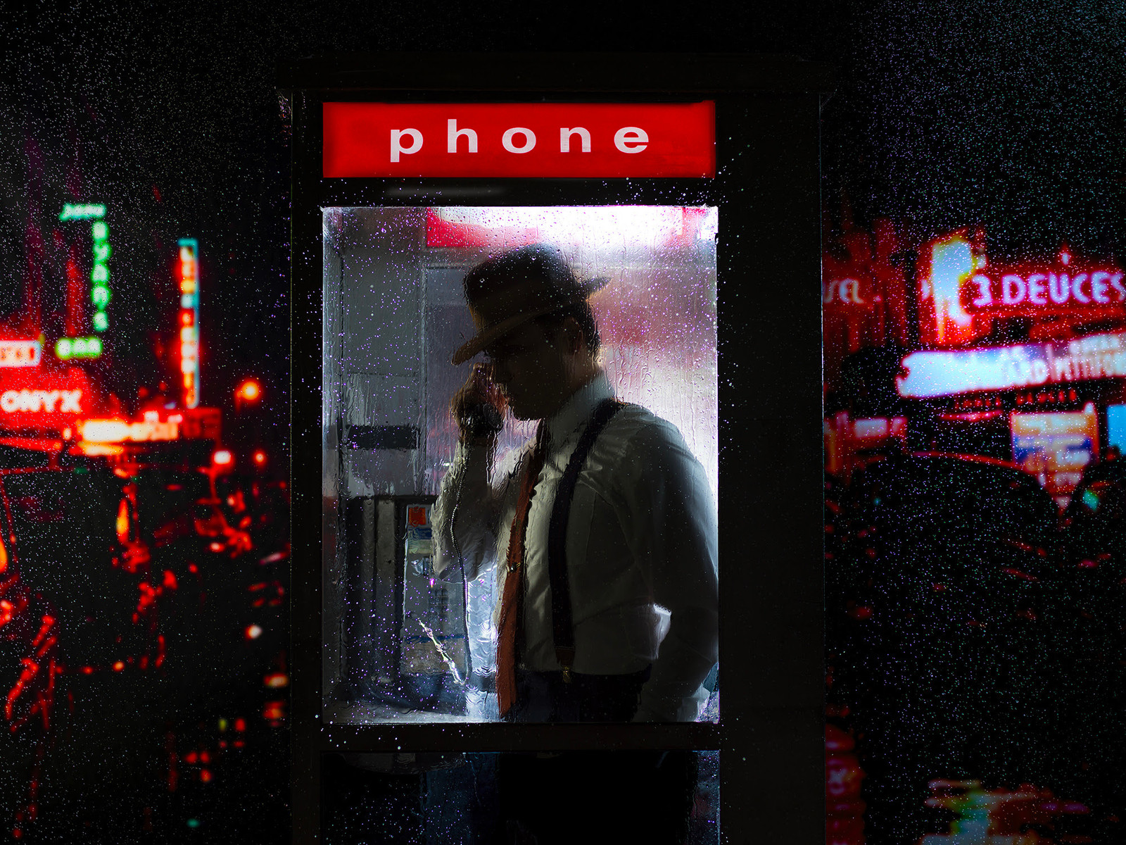 Tyler Shields - The Man in the Phone Booth, 2022, Digital c print