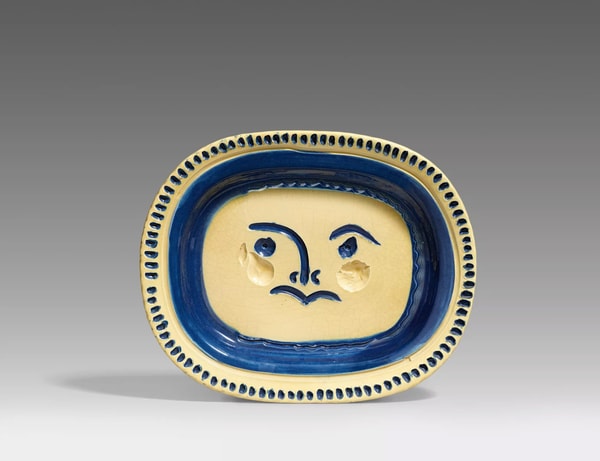 Pablo Picasso - Visage gravé, 1948, White earthenware clay,, engobe decoration, engraved under yellow glaze blue, straw co...
